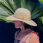 Female wearing straw hat Tulum Mexico