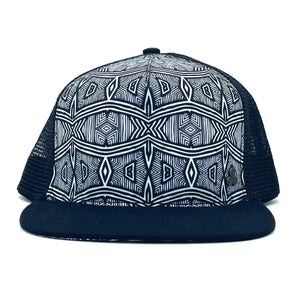 Front view of the Afrika Trucker Hat, featuring a bold black & white graphic print, breathable mesh, and a flat brim.