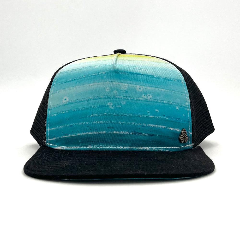 Front view of the Atlantis Trucker Hat in Tide Pool color, featuring a breathable mesh back and flat brim.