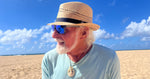 Male model styling the Charlie Fedora, showcasing eco-friendly fedora with black band and coconut button.