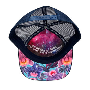 Underside of Floral Orchid Trucker Hat highlighting breathable mesh back and inner quote.