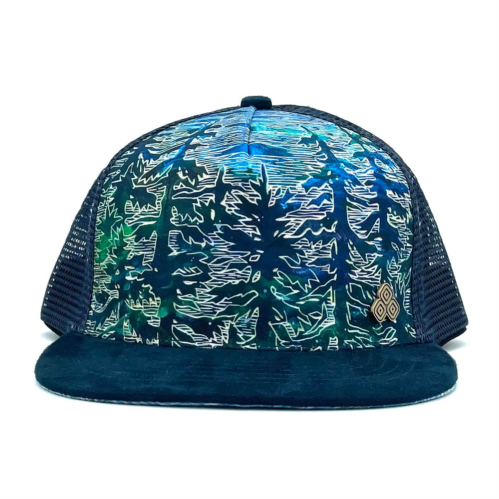 Front view of the Tree Trucker Hat with five-panel low-profile design and faux suede visor.