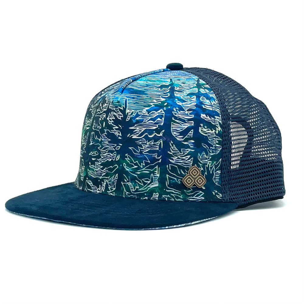 Side profile of the Tree Trucker Hat, showing the adjustable mesh back and faux suede visor.