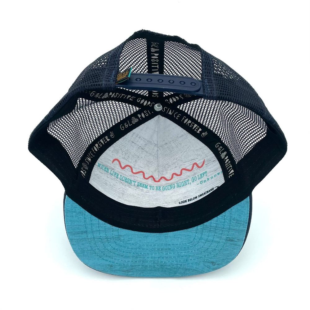 Underside view of the Visions Sky Trucker Hat, showcasing durable construction, soft interior, and flat brim.