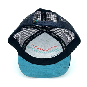 Underside view of the Visions Sky Trucker Hat, showcasing durable construction, soft interior, and flat brim.