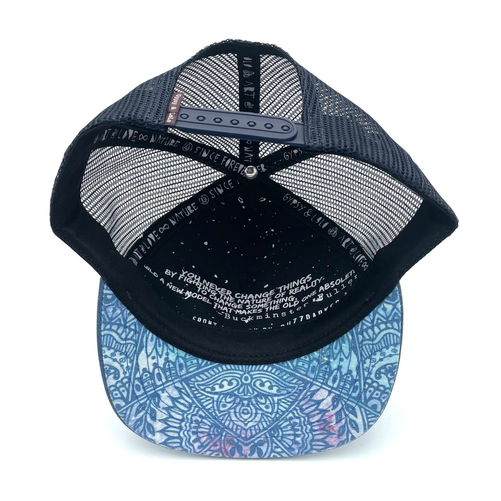 Underside view of the Zen Doodle Trucker Hat, showing flat brim, recycled fabric, and soft interior.