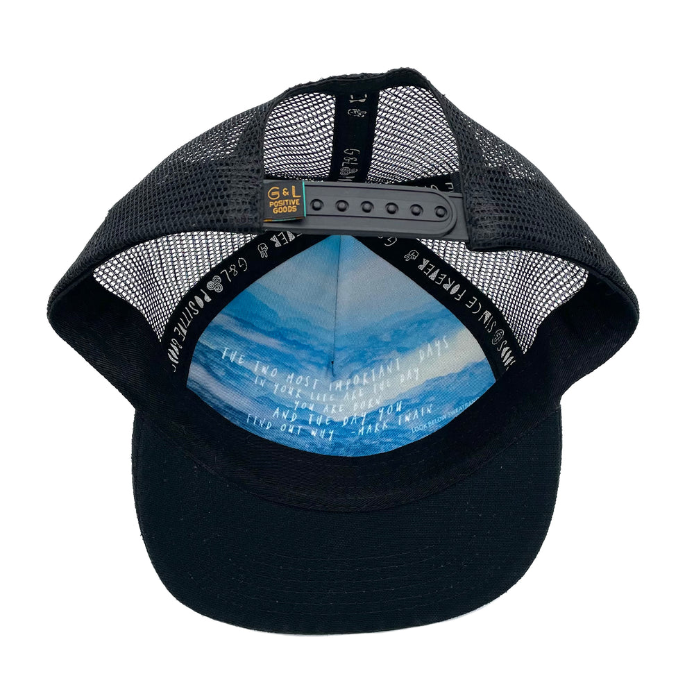 Underside view of the Zuma Trucker Hat showing soft interior, flat brim, and detailed stitching.